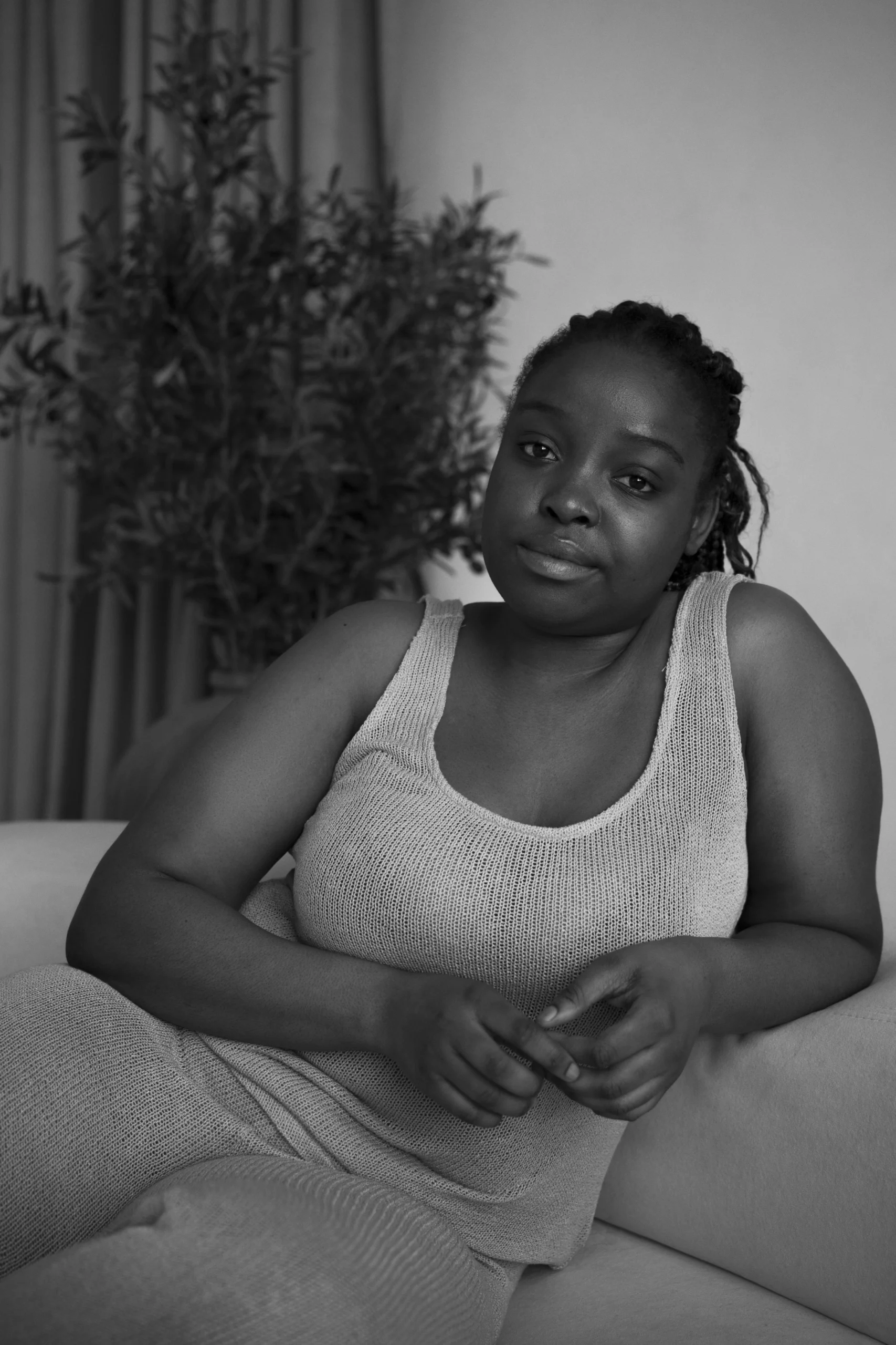 medium-shot-woman-laying-couch-black-white_converted